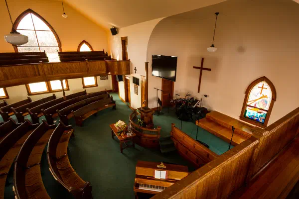 The cross and stained glass at the front
